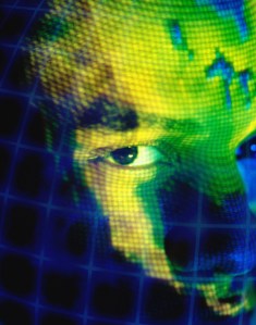 Digitized image of a man's face overlaying the globe