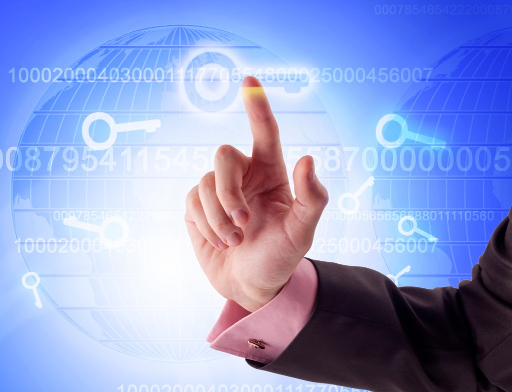 Man's forearm and hand, index finger extended to point to one of a series of "digital keys"