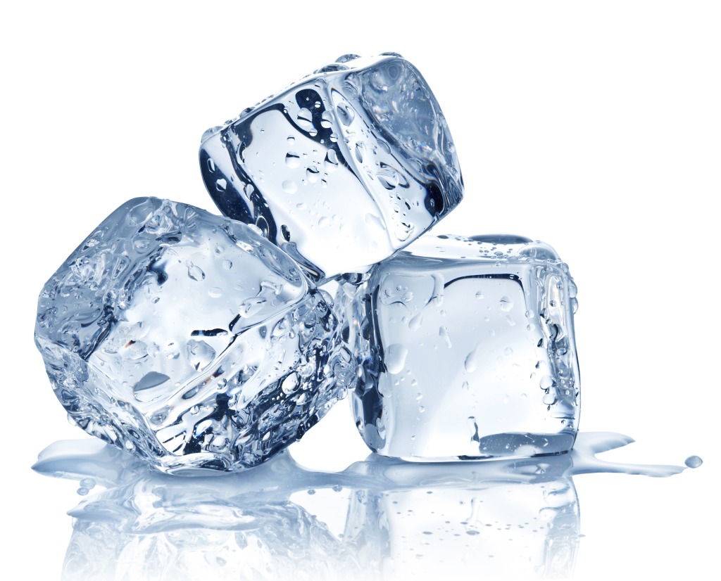 A pictures of three ice cubes, stacked, and melting slightly.